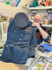 RAF uniform tunic with pilot’s wings and medal ribbons, and peaked cap, of G/Capt Marcus Robinson, being shown at the Museum