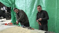 Dave and Brad riveting new wing panels to port wing.