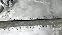 Corrosian between the steel wing spar and aluminium wing panels.