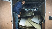 Julian Richardson, loading the Casa tailplane items into his van to bring back to the Museum.