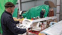 Dave checking the plan before spraying lighter green on the tail flaps.