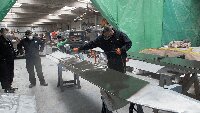 Tail flaps receiving their leighter green camouflage coating.