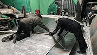 Dave Brocklehurst MBE and Dave Hertz marking out the dark green camouflage sections.
