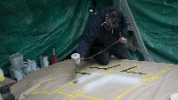 The white of the Balkan Crosses being sprayed in by Julian.