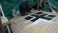 Julian unmasking the newly sprayed white areas of the Balkan Crosss on the upper wing.