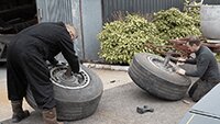 Meanwhile Clint and Brad, working on the Heinkel wheels prior to spraying.