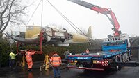 Lifted off the transporter and placed onto two stands so that the undercarriage can be locked down.