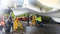 Undercarriage legs down and wheels bolted to them.