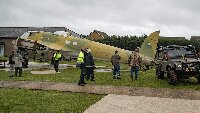 Towing the fuselage into position across the temporary track.
