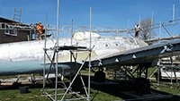 The team from Access Solutions Kent Scaffolding Services, erecting a temporary covering over the fuselage section.