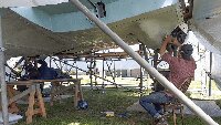 Dave Brocklehurst MBE and museum volunteer Rick, finishing off stripping the fuselage to bare metal.