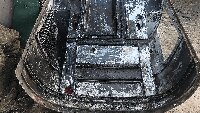 Degreasing the inside of one of the engine cowlings.