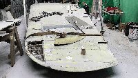 Repairing damaged or corroded panels on the wingd commences.