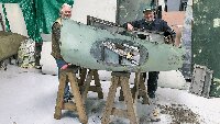 Neil Woolliams and Derek Sutton working on the engine cowlings.