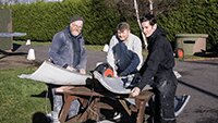 Clint Mitchell with Museum volunteers Dave Brocklehurst and Mitchell Carr preparing panels for re-painting..