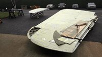 Replacing a damaged wing panel.