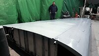 Julian inspecting his work on the wing underside.