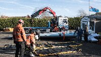 5 February 2020, with each wing weighing about a ton, Darren Scott of Scott's Transport the Search and Rescue team from Kent Fire Brigade and Museum volunteers prepared to flip over the two wings so that their top sides could be prepared for painting.