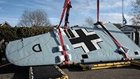 Gradually flipping the port wing over.