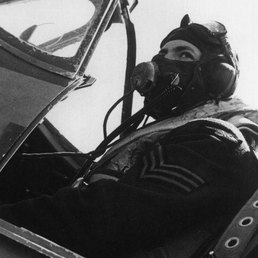 An RAF sergeant pilot in his cockpit, wearing his oxygen mask. An RAF sergeant pilot in his cockpit, wearing his oxygen mask.
