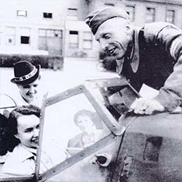 Luftwaffe airman showing girlthe cockpit of a Me109. Luftwaffe airman showing girlthe cockpit of a Me109.