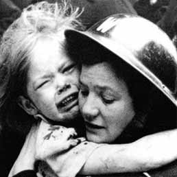 Air Raid Warden rescues a child after a V1 rocket attack.