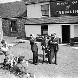 Civilians watching aerial combat outside the Royal Oak pub. Civilians watching aerial combat outside the Royal Oak pub.